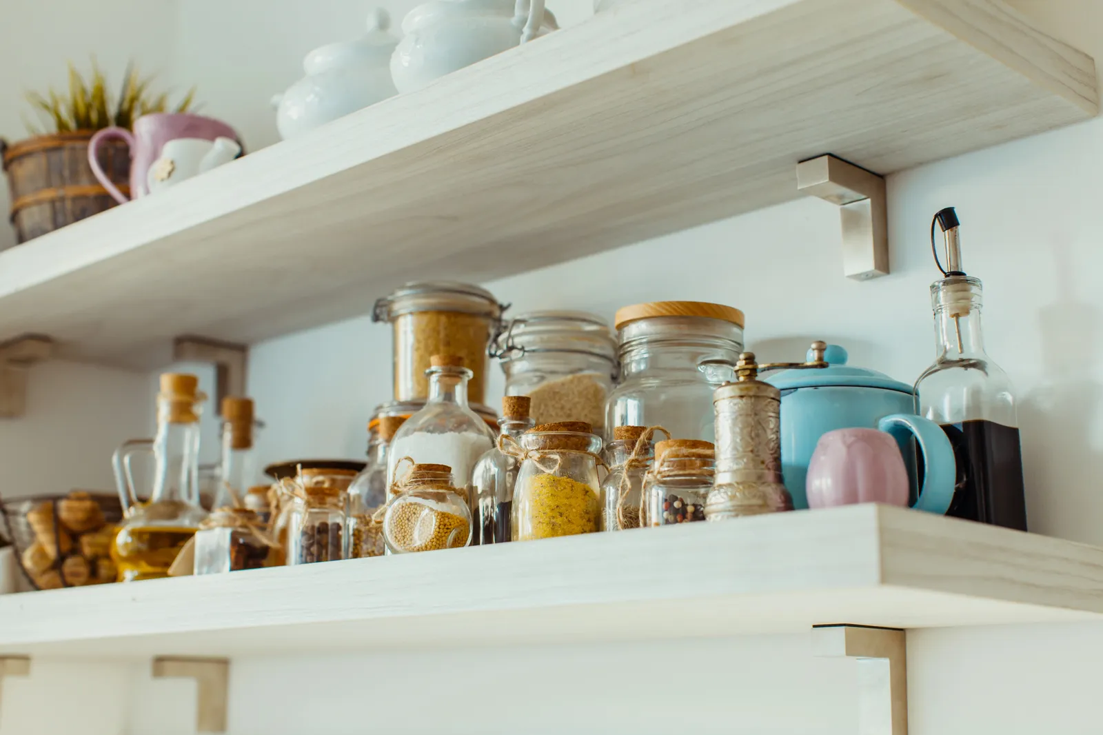 Open shelves with various food and spice ingredients