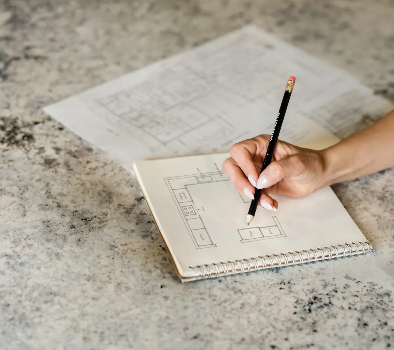Hand sketching a kitchen floor plan layout
