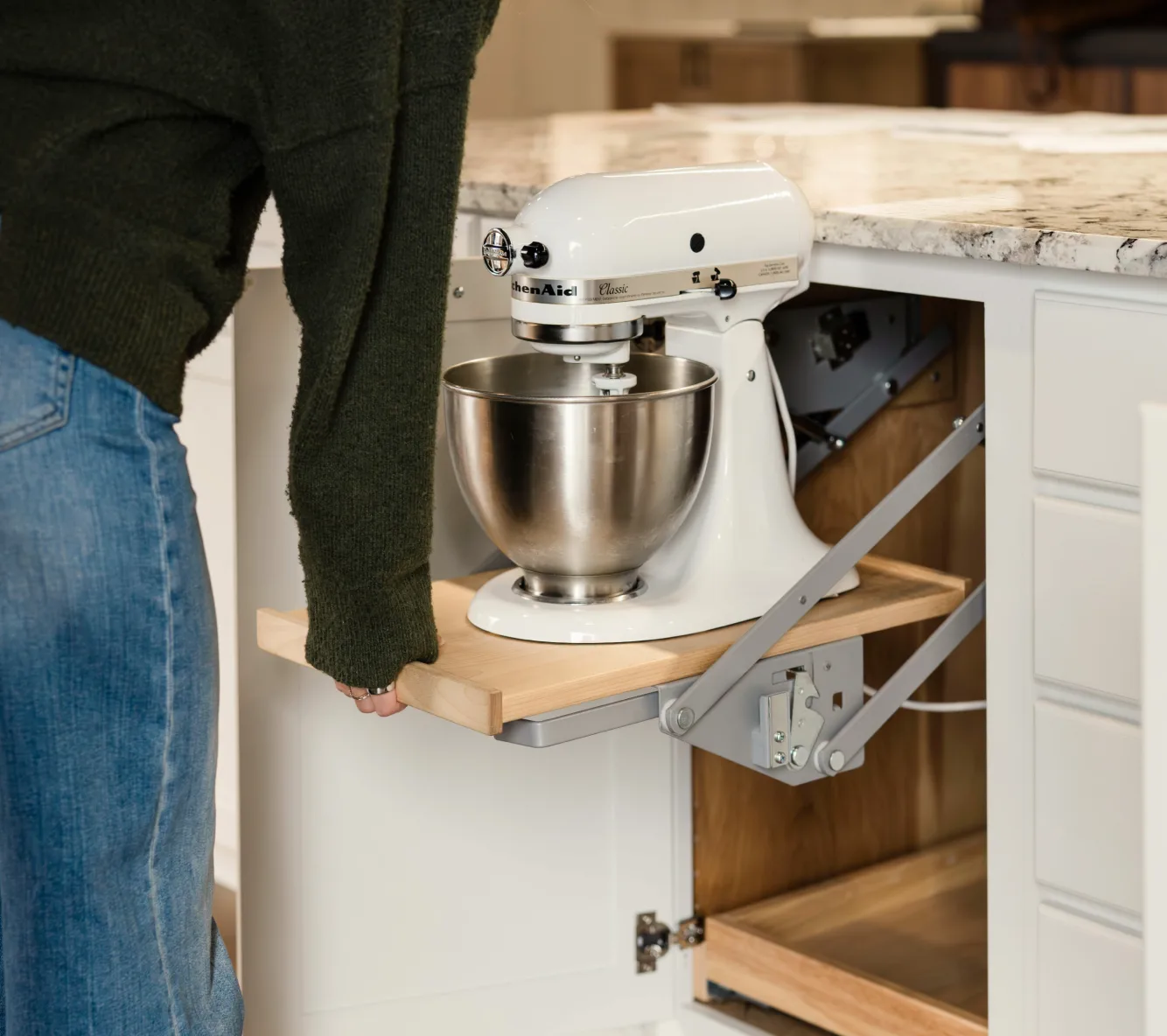 Stand mixer rising on a pull-up cabinet shelf lift
