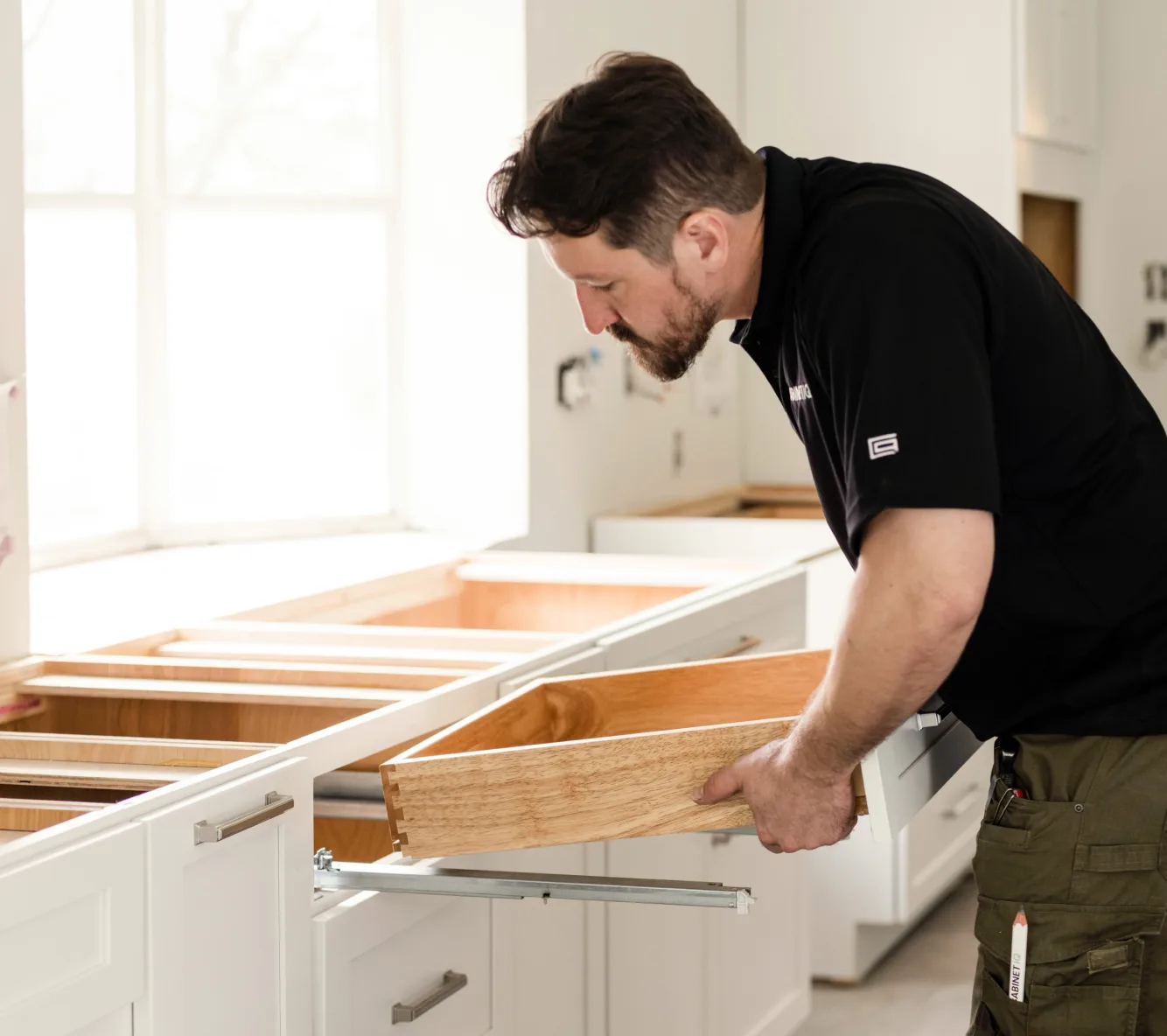 Cabinet IQ installer fitting a dovetail drawer box during installation
