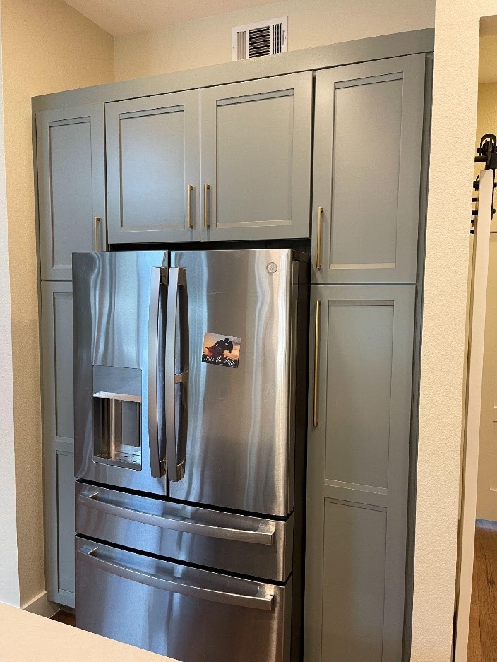 New cabinets and fridge installed by cabinet iq